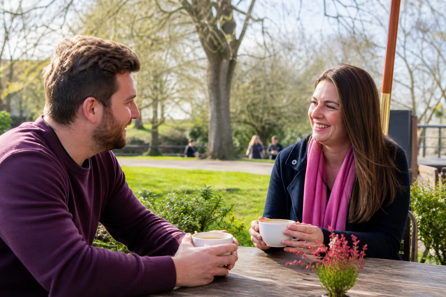 Two people talking over coffee in central Basingstoke
