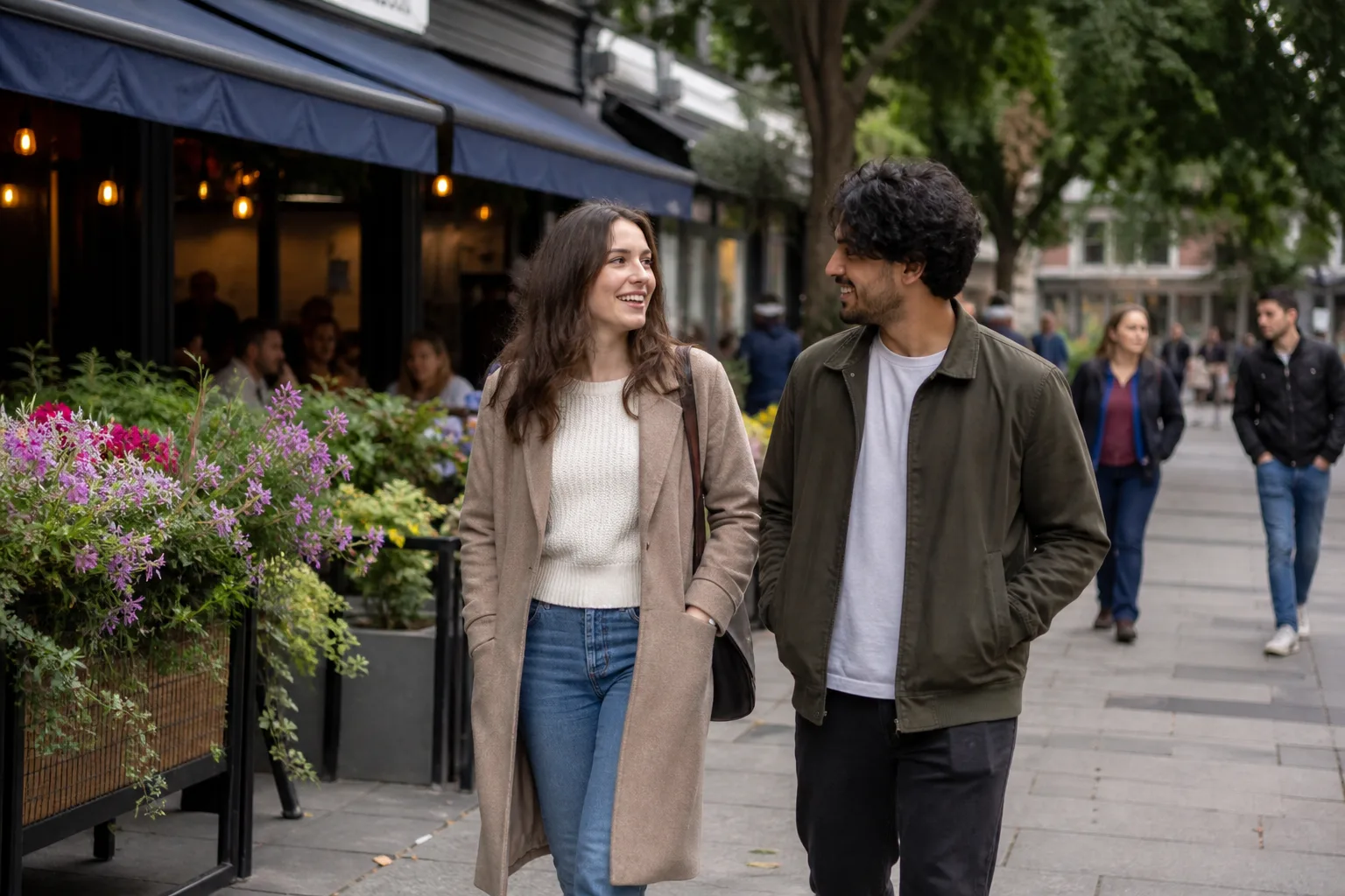 A couple walking together through a green park in Basingstoke